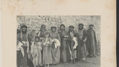 A group portrait of several men and children in Ahvaz, Iran (Sheikh Mizal Khan's men), from Photographs of Iran, Iraq, Caucasus and Turkey - A.P.H. Hotz, circa 1890