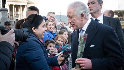 King Charles is given a rose for Valentine's Day as he meets members of the public before talking with members of the Syrian diaspora community in Trafalgar Square in February 2023. Getty Images