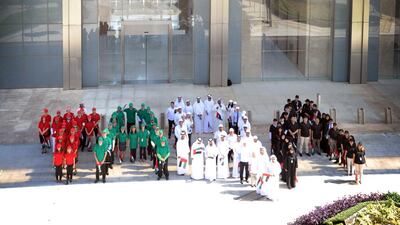 Staff at TAQA’s headquarters in Abu Dhabi celebrated the United Arab Emirates’ National Flag Day on Sowwah Square by sporting the national colours of red, black, white and green. Courtesy TAQA