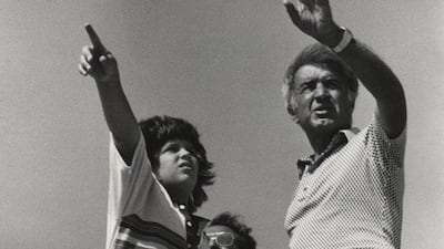 Moustapha “was trying to preach a message of love and peace, and yet he faced such opposition and controversy”, the director’s son says. Pictured: Moustapha Akkad with son Malek on set in Libya