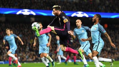 Lionel Messi controls the ball in front of Raheem Sterling. Shaun Botterill / Getty Images