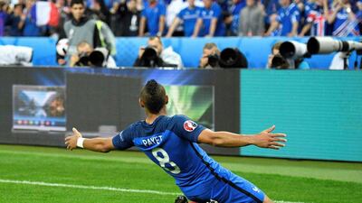 Dimitri Payet celebrates after scoring France’s third goal. Martin Bureau / AFP