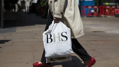 A shopper carries a BHS bag on Oxford Street in London. The BHS saga continues to unfold. Jack Taylor / Getty Images