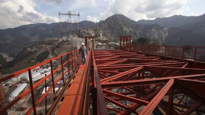An engineer walks on an iron structure at the construction site of a railway bridge in Kouri in the Reasi district in Jammu and Kashmir state. Mukesh Gupta / Reuters