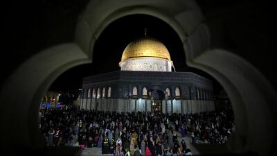 Palestinians pray in front of the Dome of the Rock during Ramadan, at the Al Aqsa Mosque compound, in Jerusalem's Old City. Reuters