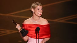 Irish actress Jessie Buckley accepts the award for Best Actress. Photo: AFP