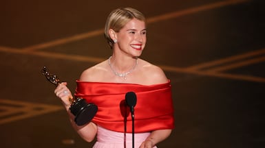 Irish actress Jessie Buckley accepts the award for Best Actress. Photo: AFP