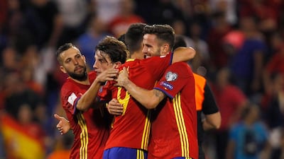 Spain's players celebrate after securing their place in next year's tournament finals in Russia (AP Photo/Alberto Saiz)