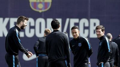 Barcelona players, including Lionel Messi, right, and Neymar centre, prepare for their Uefa Champions League quarter-final second leg against Atletico Madrid. Albert Gea / Reuters