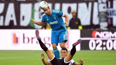 Chiellini of competes for the ball with Roberto Inglese of Parma. Getty
