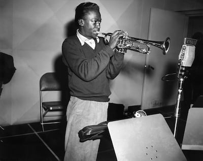 Davis rehearses in the studios of radio station WMGM for a session with the Metronome Jazz All-Stars in 1951 in New York. Getty.