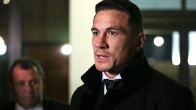 New Zealand's Sonny Bill Williams speaks to media while assistant coach Ian Foster looks on after a judicial hearing at the New Zealand Rugby offices on July 2, 2017 in Wellington, New Zealand.