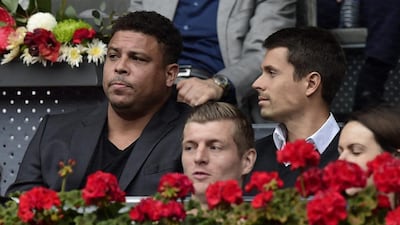 Former Brazil footballer Ronaldo, left, and Real Madrid’s German midfielder Toni Kroos, centre bottom, attend the tennis match between Serbia’s Novak Djokovic and Spain’s Roberto Bautista Agut. Javier Soriano / AFP