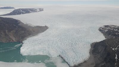 Scientists have warned the Greenland ice sheet is cracking open faster than previously thought. PA