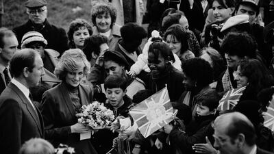Princess Diana meets members of the public during a visit to a community centre in north London in 1985. Getty