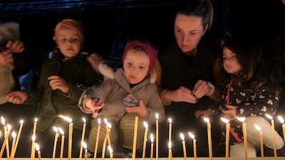 Children in Montenegro's capital Podogrica light candles for the victims of a mass shooting in the nearby town of Cetinje. AP Photo