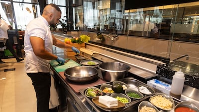 Chef Rakish of Novotel Dubai World Trade Centre prepares healthy food at the Embers restaurant. Antonie Robertson/The National