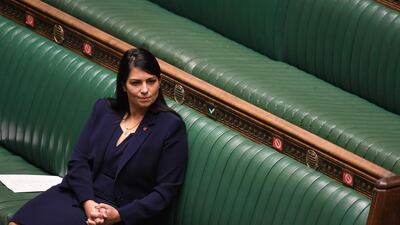 Britain's Home Secretary Priti Patel listens as Britain's Prime Minister Boris Johnson speaks in the House of Commons in London on November 2, 2020 on new coronavirus lockdown measures. AFP