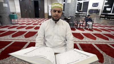 Imam Ahmad Al-Harasis reads the Quran at Abdullah Ben Sallam mosque in Amman, Jordan. reuters