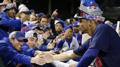 Chicago Cubs catcher Willson Contreras celebrates with fans. Nam Y. Huh / AP