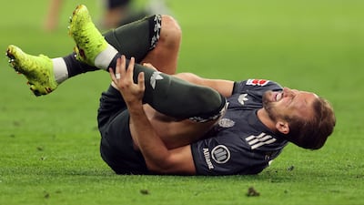 Bayern Munich striker Harry Kane was withdrawn after picking up an ankle injury against Bayer Leverkusen. AFP