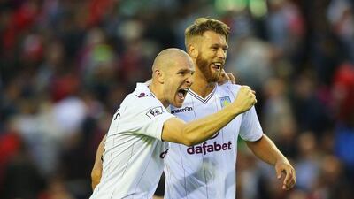 Philippe Senderos, left, of Aston Villa celebrates the club's victory over Liverpool in the Premier League on Saturday with teammate Nathan Baker. Alex Livesey / Getty Images / September 13, 2014