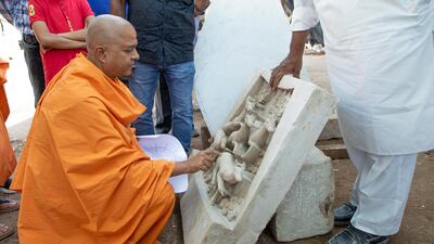Swami Brahmavihari, head of international relations for Baps Swaminarayan Sanstha, the organisation building the temple in Abu Dhabi, checks the stone work in India. Photo: Baps Hindu Mandir