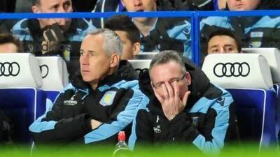 Paul Lambert, the Aston Villa manager, watches as his side are defeated 8-0 by Chelsea.
