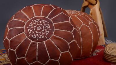 A handmade leather pouffe by L'uccelo, available on Al Bon for Dh918