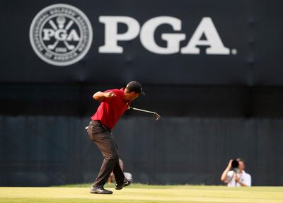 Tiger Woods celebrates his birdie putt on the 18th green during the final round of the PGA Championship golf tournament at Bellerive Country Club, Sunday, Aug. 12, 2018, in St. Louis. AP Photo