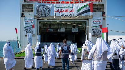 Officials and aid workers gather at Khalifa Port as the UAE’s Mother of the Nation aid ship prepares to set sail for Gaza. Ahmed Ramzan / The National