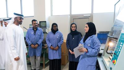 Sheikh Mohamed speaks with a student during the visit.
