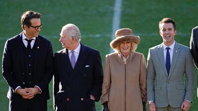The king and queen consort talk to Wrexham football club owners Ryan Reynolds, left, and Rob McElhenney, right. Getty