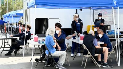 People receive their second booster in Long Beach, the US in March. Getty