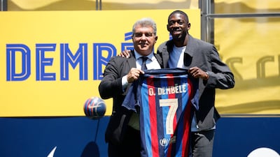 Ousmane Dembele with Barcelona president Joan Laporta after the French attacker signed a new contract. Reuters