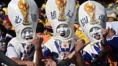 Japan fans cheer prior to the start of the Group C match between Colombia and Japan on Tuesday night at the 2014 World Cup in Cuiaba, Brazil. Luis Acosta / AFP