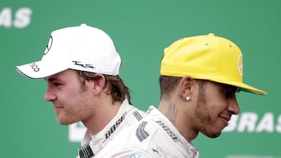 First placed Formula One driver Nico Rosberg, left, of Mercedes and his teammate, second placed Lewis Hamilton on the podium after the 2015 Formula Grand Prix of Brazil at the Interlagos racing track, in Sao Paulo, Brazil, 15 November 2015. EPA/Sebastiao Moreira