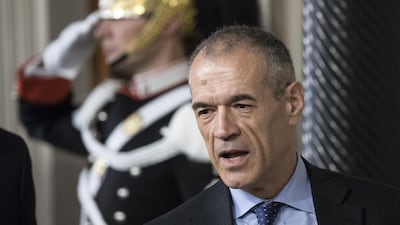 Carlo Cottarelli addresses a press conference at the Quirinale Palace in Rome after being asked to form an interim government by President Sergio Mattarella. Alessia Pierdomenico / Bloomberg