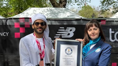 Sadique Ahamed being presented with a certificate for his achievement at the end of this year's London Marathon. Photo: Guinness World Records