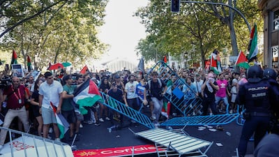 Demonstrators, some holding Palestinian flags, protest during the 21st and last stage of La Vuelta a Espana cycling race, a 103. 6 km race between Alalpardo and Madrid, in Madrid, Spain. EPA