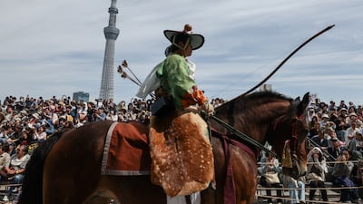 An archer in traditional clothes riding a horse during the 42nd Asakusa Yabusame (horseback archery) ritual in Tokyo. Getty Images