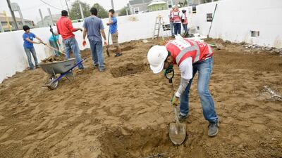 Volunteer Abed Al Blooshi digs deep for the Habitat for Humanity project.