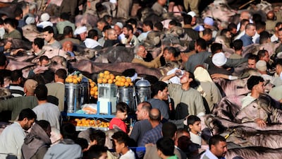 Cattle traders and customers crowd the Al Manashi livestock market on the outskirts of Cairo, Egypt, ahead of Eid Al Adha. Reuters