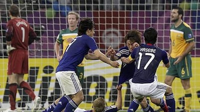Japan and Australia are among the top Asian football teams. Kin Cheung / AP Photo