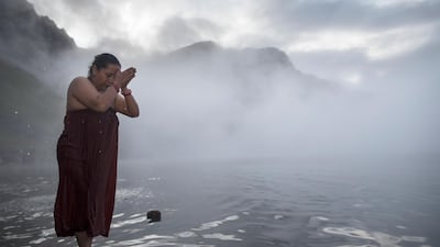 A devotee takes a holy dip in the cold Gosaikunda Lake. Narendra Shrestha/EPA