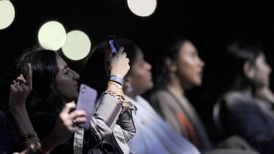Saudi women take a selfie as they attend a concert by Egyptian pop sensation Tamer Hosny. Amer Hilabi / AFP