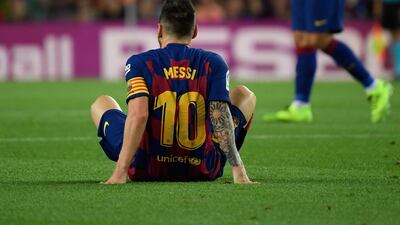 Barcelona's Argentine forward Lionel Messi waits to receive medical treatment for an injury. AFP