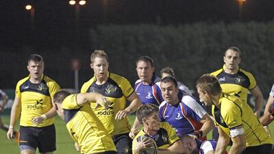 Stakes were high for Friday night’s game between Xodus Wasps, in yellow, and Jebel Ali Dragons. Clint McLean for The National