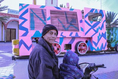 Habib Ben Mohamed on his motorbike with grandson Ahmed in Redeyef. Ghaya Ben Mbarek / The National