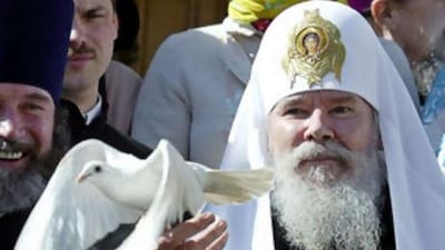 Patriarch Alexiy II releases a dove after a holiday service in the Kremlin in Moscow.